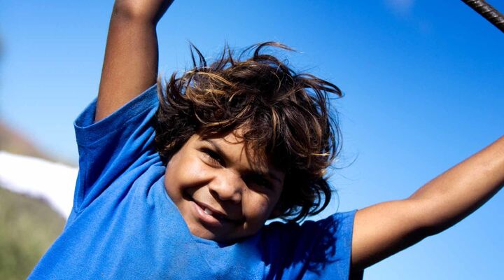 Aboriginal Boy In A Blue Tshirt Smiling
