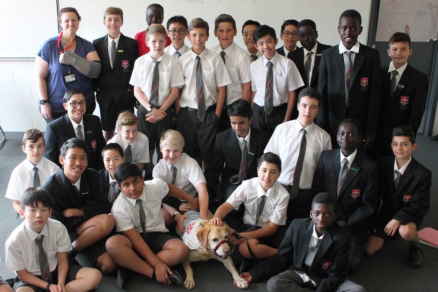Group Of School Boys With Therapy Dog