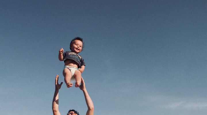 Child Getting Thrown In The Air By Father