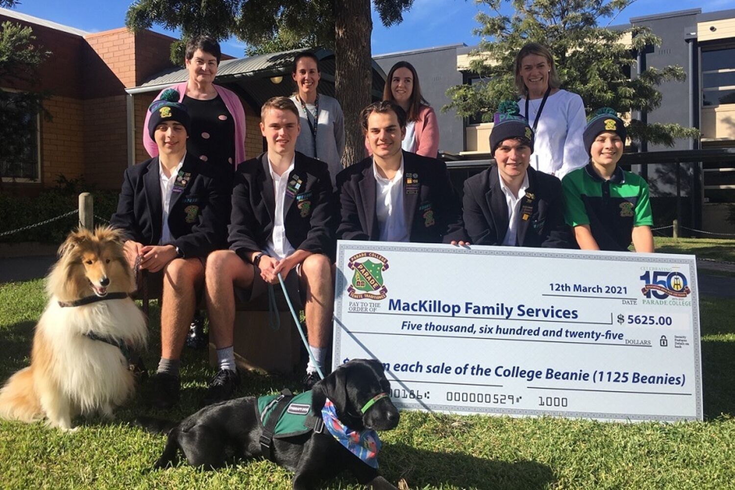 Students At Parade College With Cheque And Mackillop Staff And Therapy Dogs