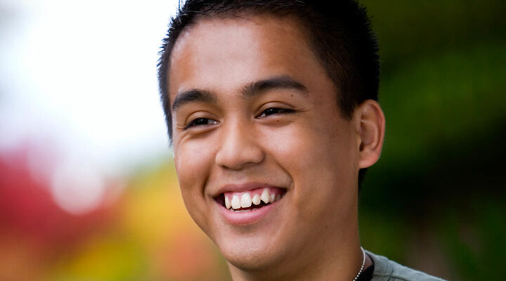 Young Multicultural Man Smiling Into Distance