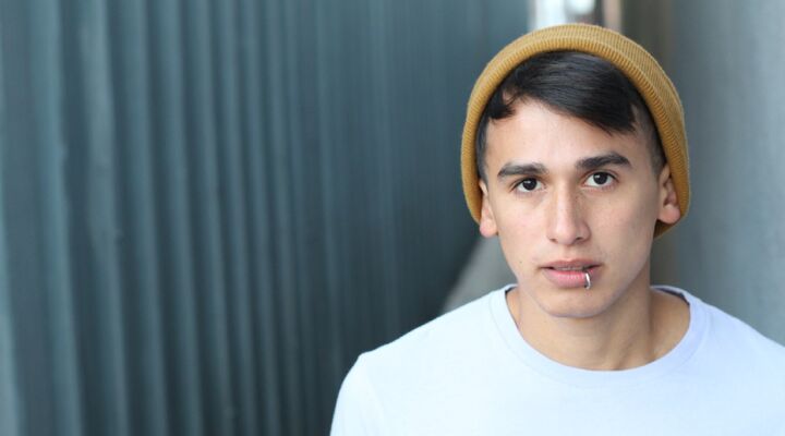 Young Man Wearing A Yellow Beanie