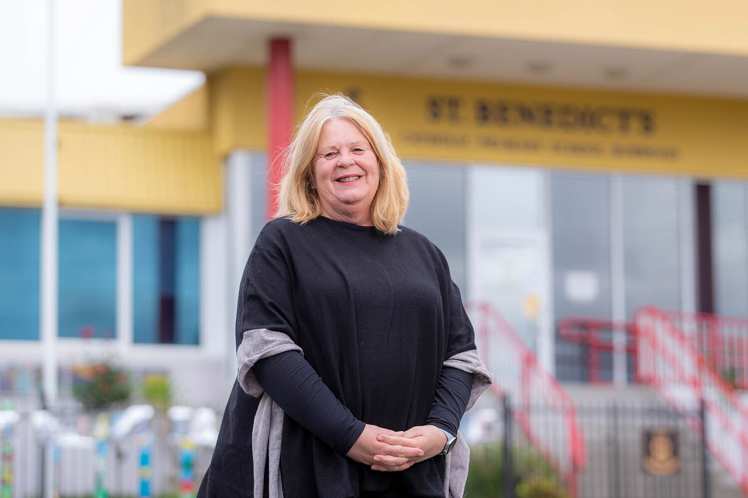 Jane Michael Standing Infront Of St Benedicts School