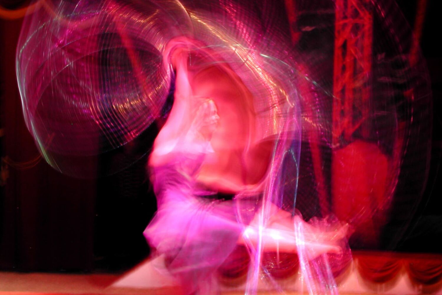 Theatre Performer In Pink Dress Blurred Through Movement